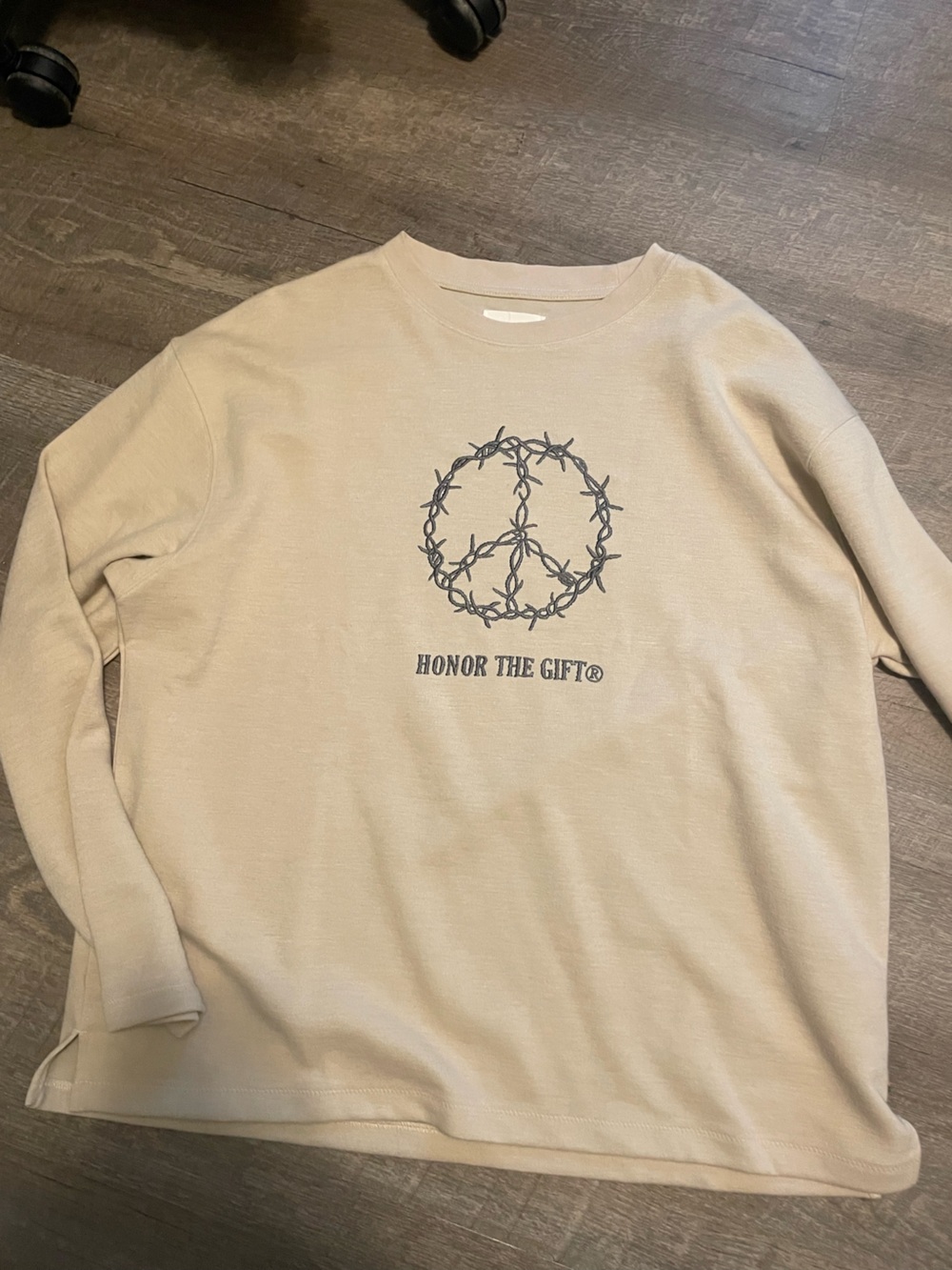 Beige Graphic Crewneck Sweatshirt with Barbed Wire Emblem